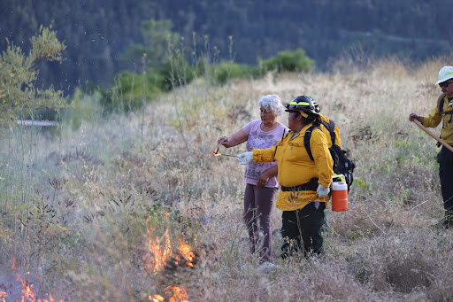 Wilverna Reece and Gina Saxon lighting fire to the land for cultural burns  in Karuk ancestral territory  © Karuk Tribe