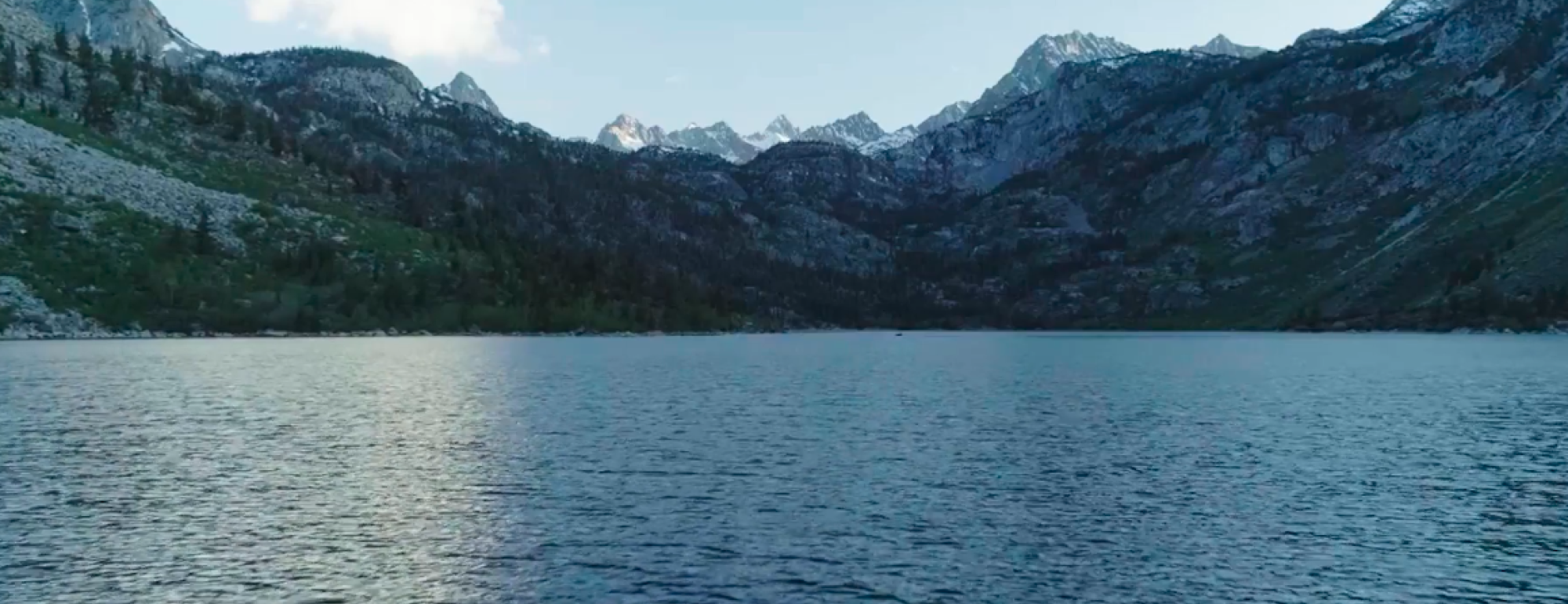 Native California History, a profound truth-telling video featuring Guiding Leaders of the Native American Studies Model Curriculum. Image is a screenshot of lake and mountains.  