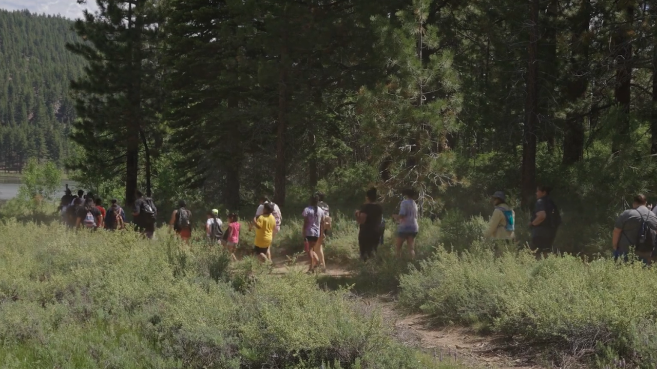 We Still Here screenshot of Native youth hikers