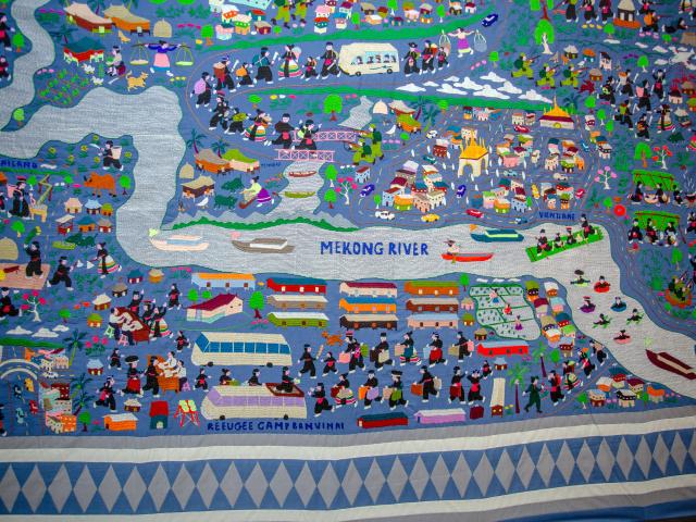 Story Cloth depicting Hmong refugees crossing the Mekong River from Laos to Thailand refugee camps from Hmongstory Legacy Collection.