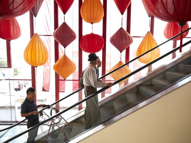 Riding the escalator at Asia Garden Mall, also known as Phuoc Loc Tho