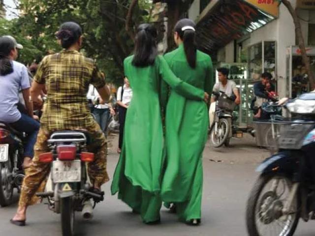 Women wearing ao dai, traditional Vietnamese attire.