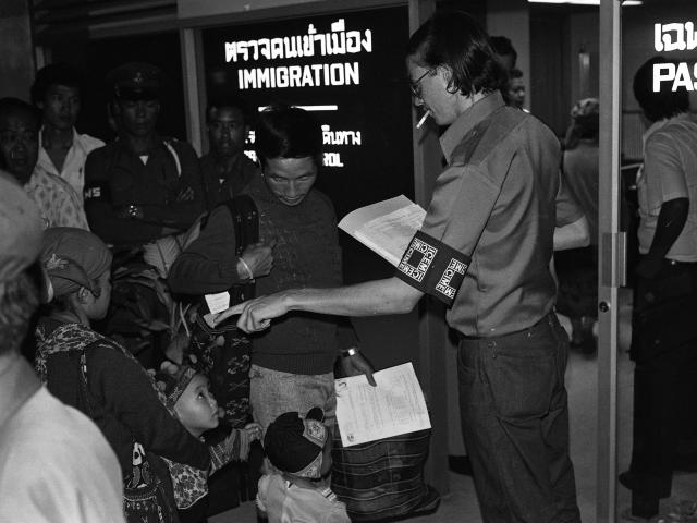 Mien family going through ICEM inspection immigration processing at the Bangkok airport in 1978 from Rich Kocher Collection.