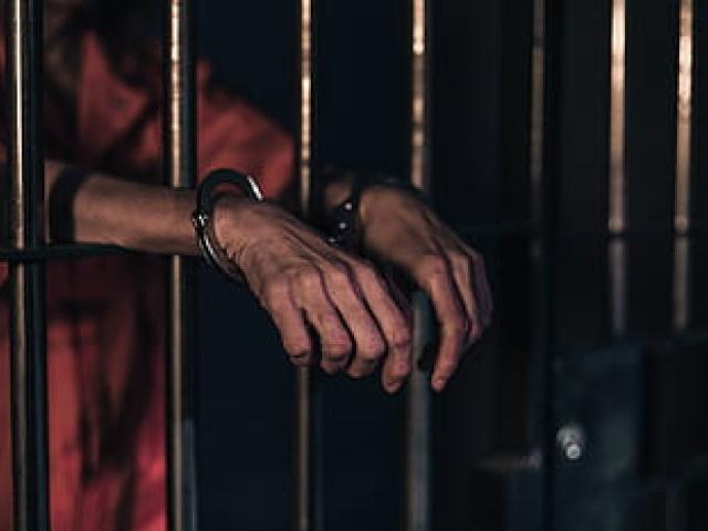 Free person with handcuffed in prison public domain people CC0 photo.