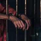 Free person with handcuffed in prison public domain people CC0 photo.