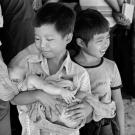 Cambodian children at the Ban Mai Rut refugee camp near Klong Yai, Thailand. There are about 5,200 refugees in this camp which has a permanent wooden structure and several new ones made of Bamboo poles thatched roofs and walls.