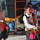 Three Hmong boys playing the qeej at the Little Mekong Night Market in St. Paul, Minnesota on August 7, 2015.