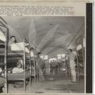 Oceanside, Calif.: Part of the first group of South Vietnamese refugees to arrive at Camp Pendleton, a sprawling Marine Corps Training Base in Southern California, get used to their surroundings in a quonset hut shortly after their arrival in the United States. As they arrived in several planeloads, word came from Saigon, capitol city of South Vietnam, that it had fallen to North Vietnamese forces.