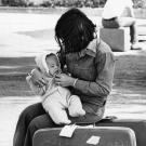 A woman dresses her baby at Camp Pendleton, where she has arrived as a refugee from Vietnam.