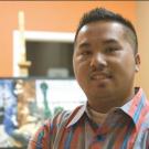 Profile image of Hmong American artist Boonma Yang.
