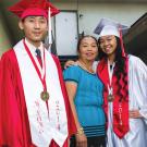 "Photo of Hmong McLane High School graduates: Valedictorian Magna Cum Laude: Thai Vang and Salutatorian Linda Her and Linda's mother Kia Thao photographed by Joaquin Hernandez for Txhawb publication 2015 article “Against the Odds” "