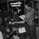 Mien family going through ICEM inspection immigration processing at the Bangkok airport in 1978 from Rich Kocher Collection.