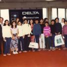 The Kem family is greeted at the airport in San Francisco. The bag held by Mrs. Kim (on the right) contains all of the families travel documents. Her son (in center of photo) is holding the only personal possessions the family had when they arrived. After their arrival in San Francisco, the family moved to the Long Beach area (circa 1980).