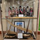 Display of traditional Hmong instruments, such as the qeej and flute. Taken at the Center for Hmong Studies at Concordia University by Ger Thao, 2022.